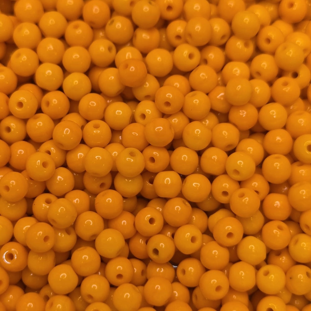 Close-up of orange round beads with a blurred background