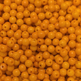 Close-up of orange round beads with a blurred background
