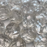Close-up of clear faceted firepolish beads with on a white background