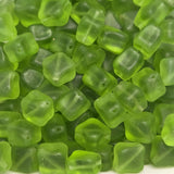 green cross square frosted beads with visible threading holes for jewelry making