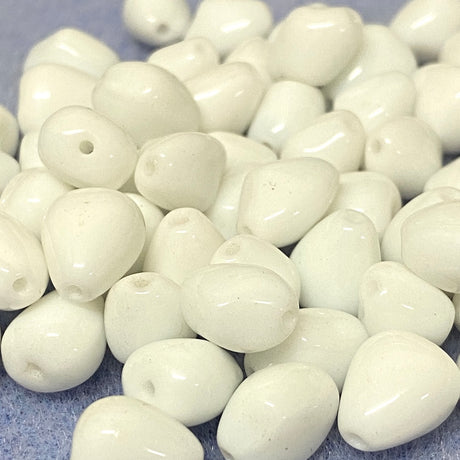 White beads on a gray background