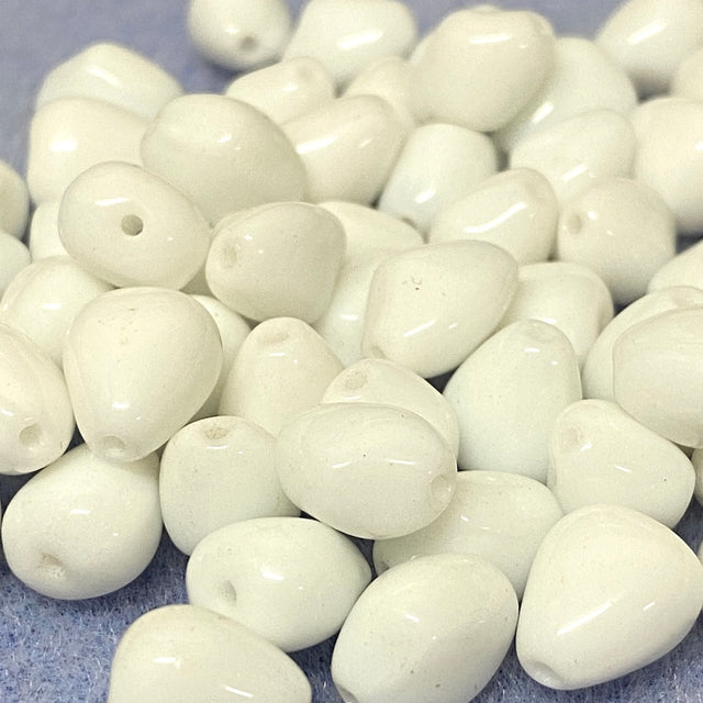 White beads on a gray background