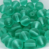 Green beads on a white background