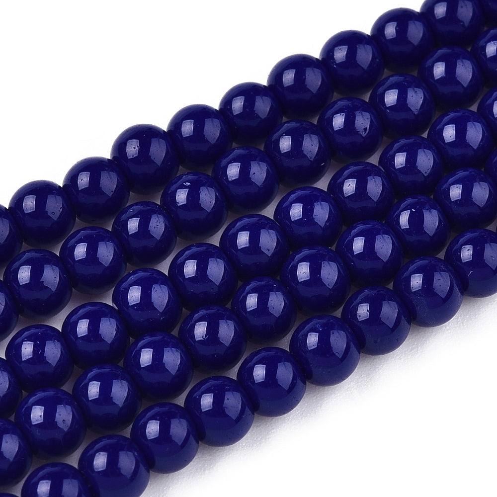 String of dark blue beads on a white background