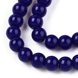 Close-up of a string of dark blue beads on a white background