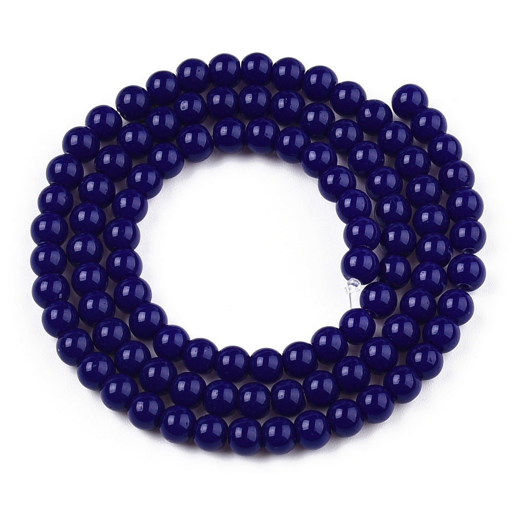Navy blue beaded bracelet on a white background