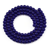 Navy blue beaded bracelet on a white background