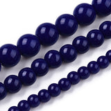 Close-up of dark blue beads on a white background
