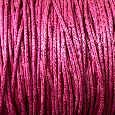 Close-up of dark pink wax cotton strands