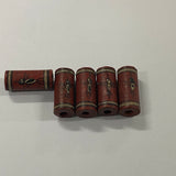Set of five cylindrical cultural ceramic beads with decorative painting on a white background