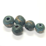 Five green and brown marbled beads on a white background