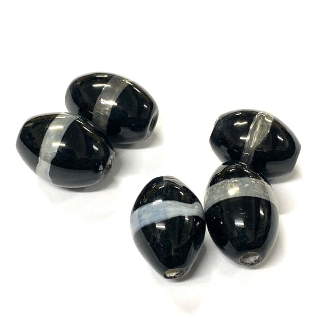 Black and silver striped beads on a white background