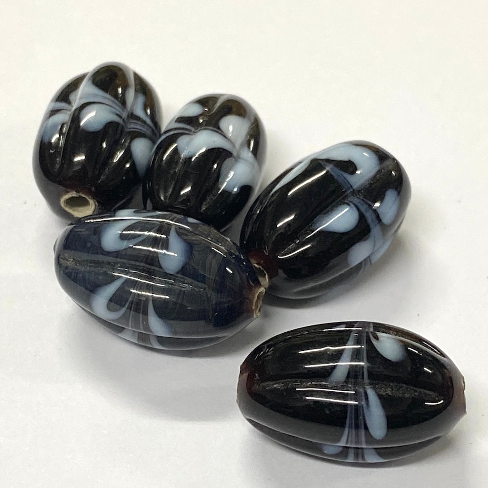 Black and white marbled beads on a white background
