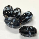 Black and white marbled beads on a white background