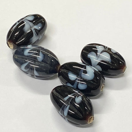 Black and white marbled beads on a white background