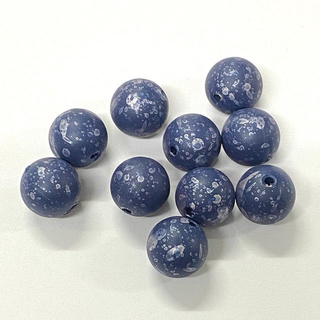 Blue marbled beads on a white background