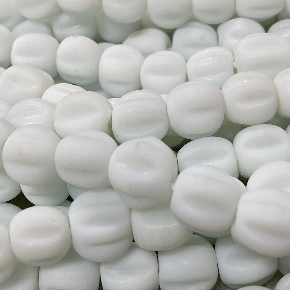 white glass beads with a glossy look