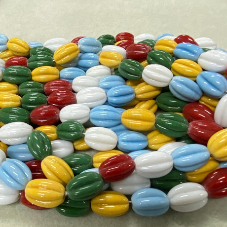 Colorful glass beads on a textured surface