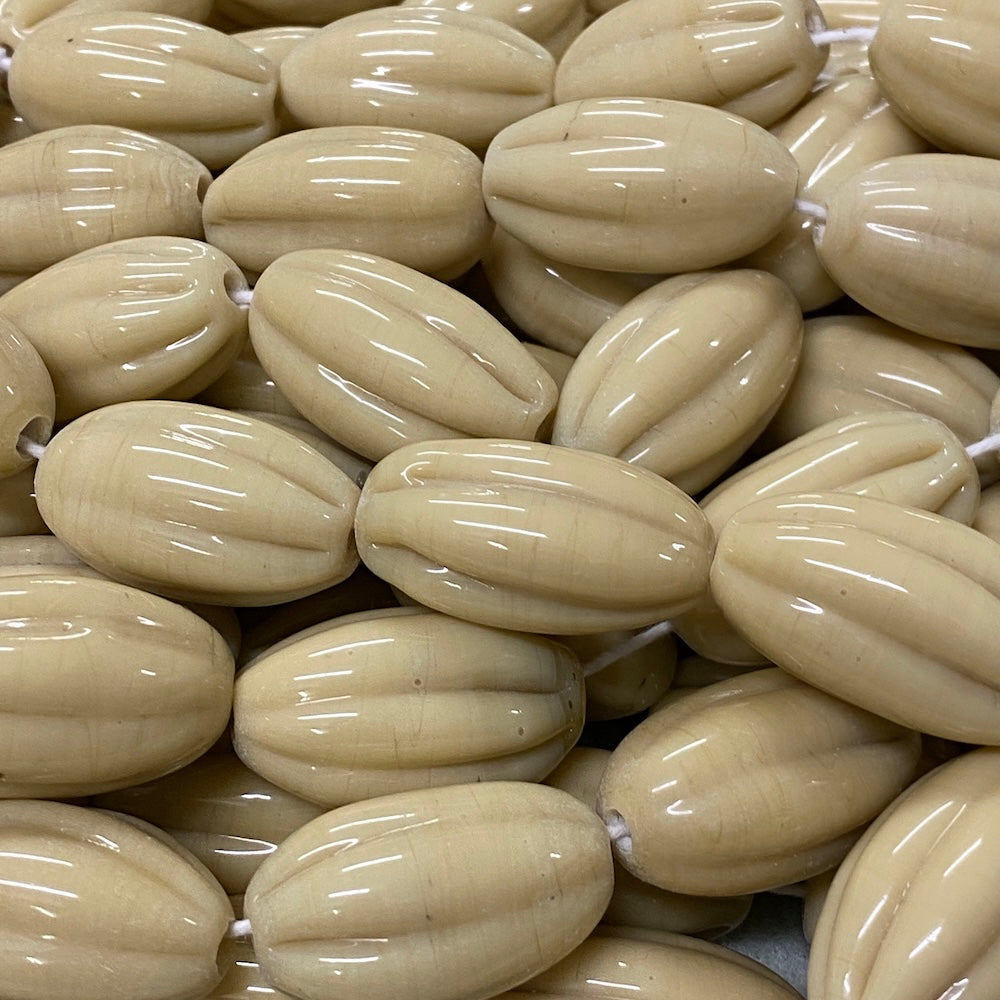 Close-up of beige beads with a glossy finish