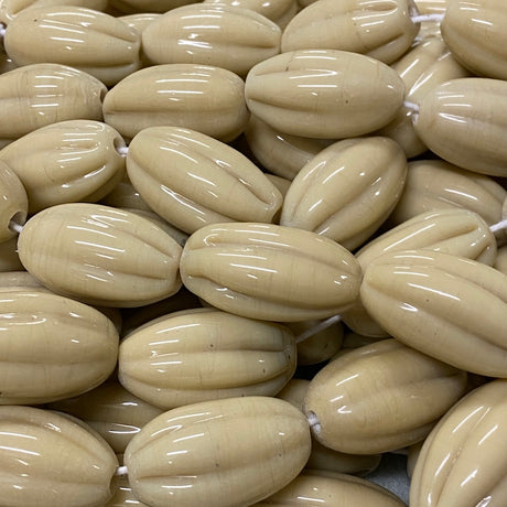 Close-up of beige beads with a glossy finish