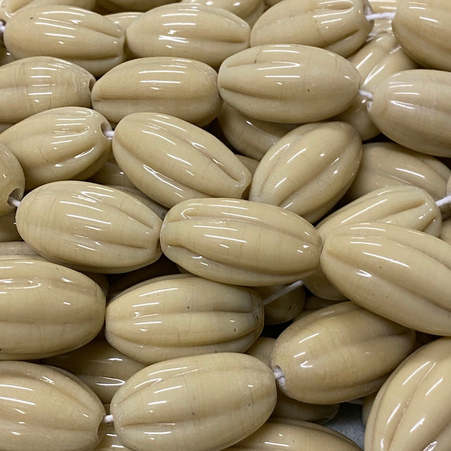 Close-up of beige beads with a glossy finish