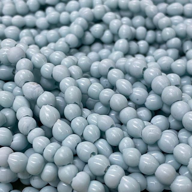 Close-up of light blue beads