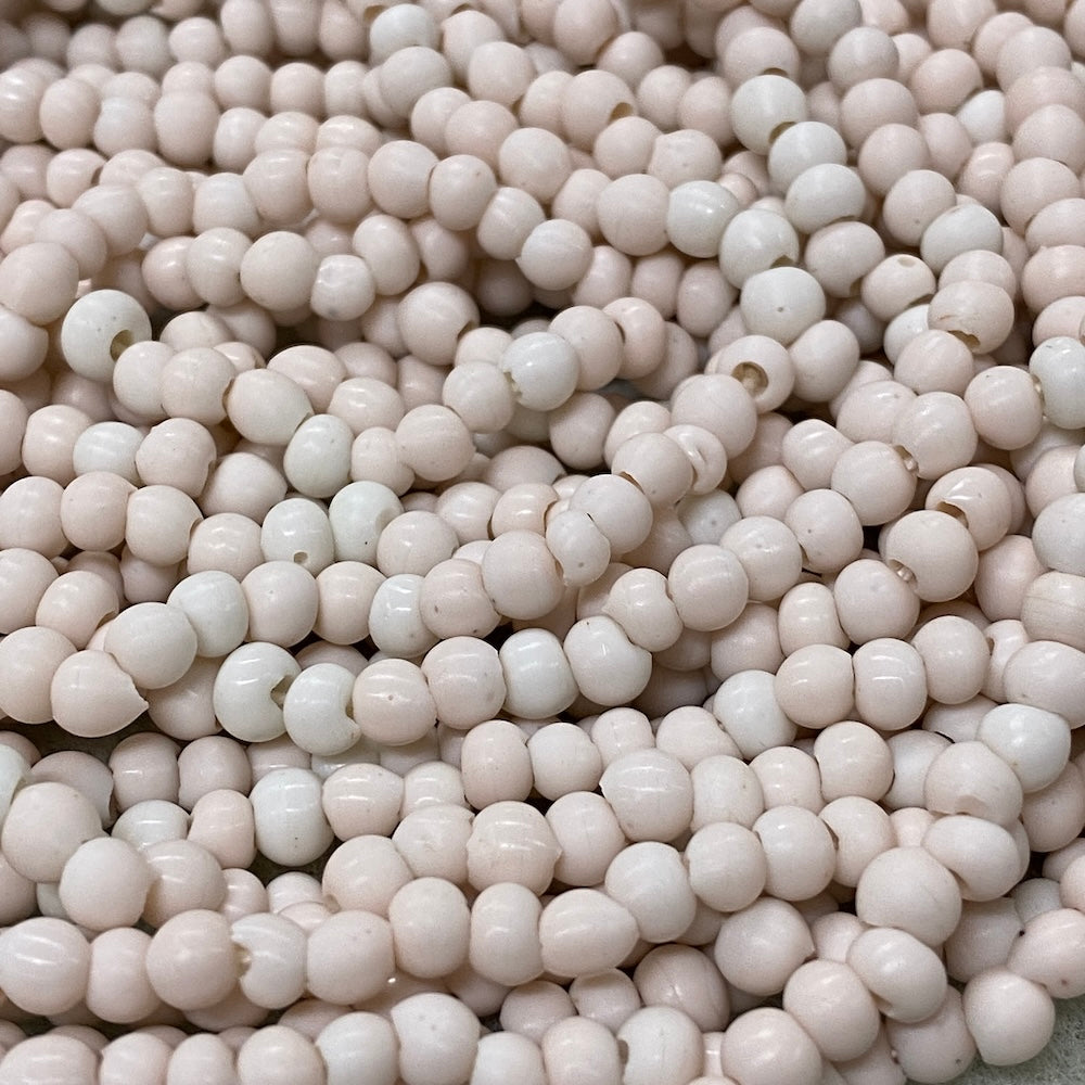 Close-up of small white beads