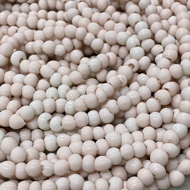 Close-up of small white beads