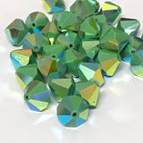 faceted green crystal beads on a white background