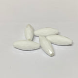 white faceted crystal beads on a grey background