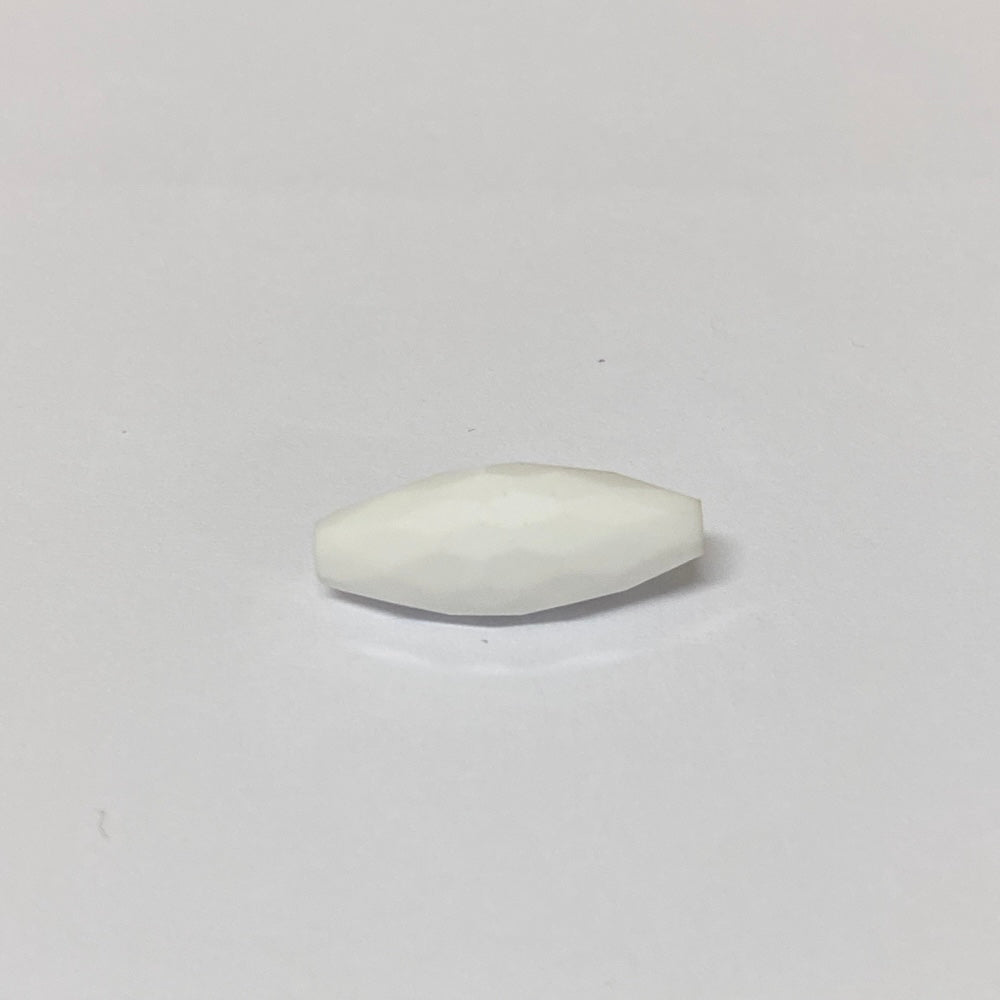 white faceted crystal beads on a grey background