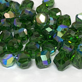 faceted green crystal beads on a white background