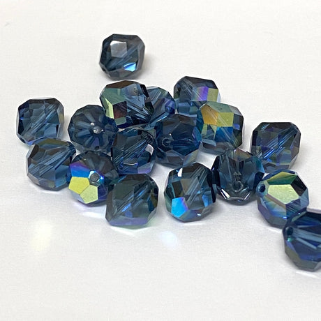 faceted blue crystal beads on a white background