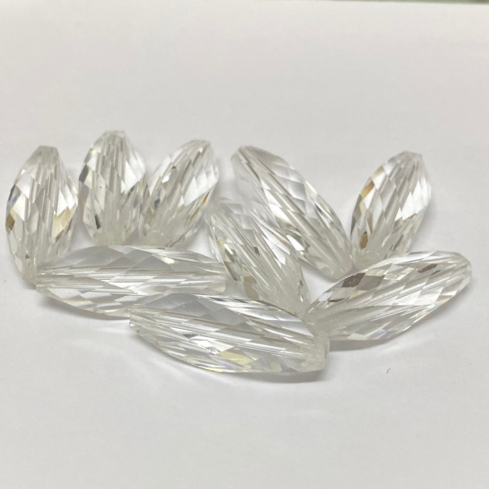 Clear crystal faceted beads on a white background