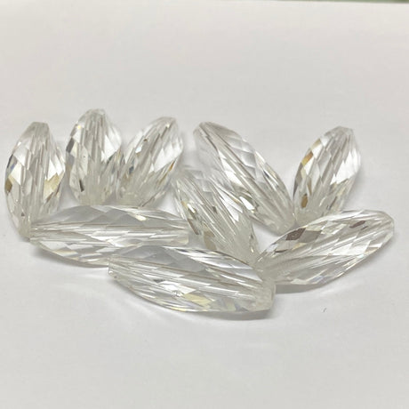 Clear crystal faceted beads on a white background