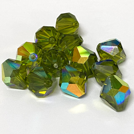 Green faceted crystal beads on a white background