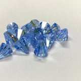 Blue faceted crystal bell shape beads on a white background