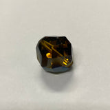 Faceted brown crystal bead on a light gray background