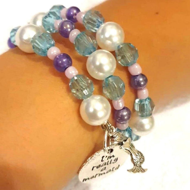 a mermaid themed hand made bracelet on a wrist