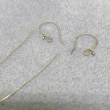 Sterling Silver Bali earring hooks and wires on a gray surface
