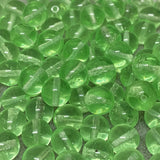 Close-up of green vintage vaseline glass beads