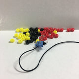 tribal pony beads with an elastic cord and clip on a white and grey background