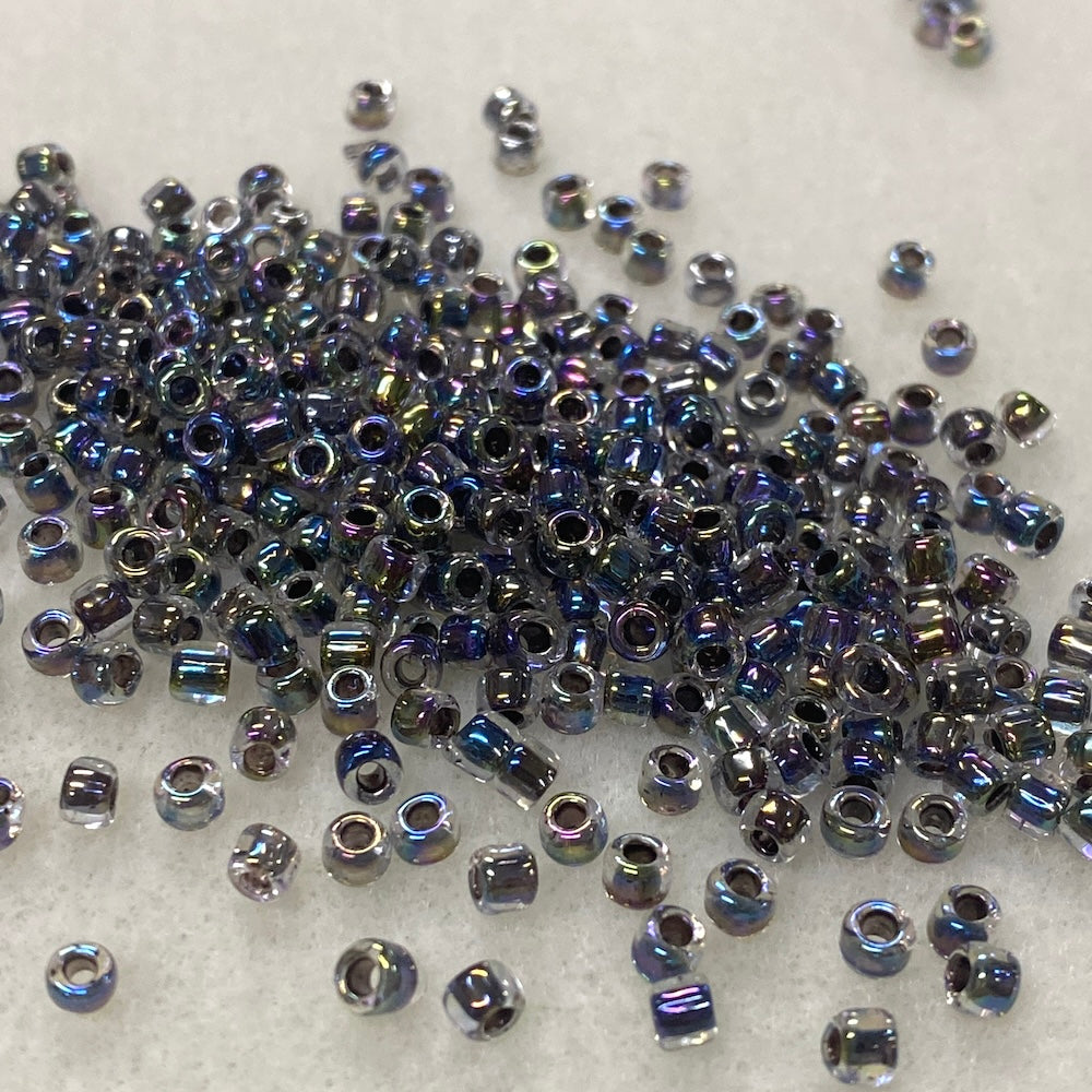 6/0 (#324) Black Rainbow Lined Transparent - 20g Tube - Bead Shack