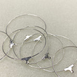 Silver ear hoop fittings with clasp on a light gray background