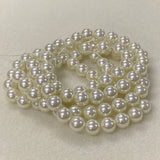 String of pearls on a light gray background