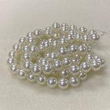 String of pearls on a light gray background