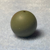 Green silicone bead on a textured gray background