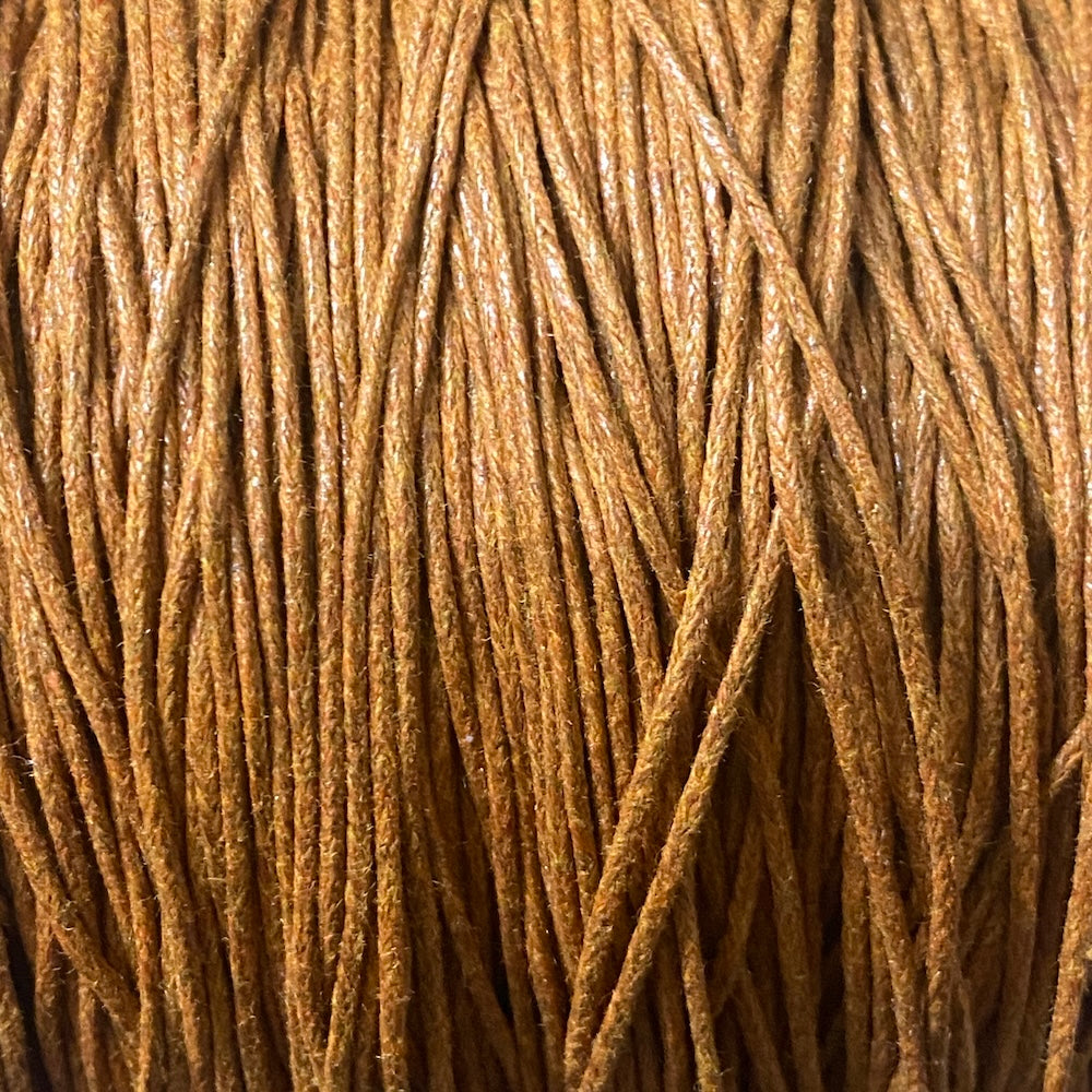 Close-up of a ball of brown wax cotton beading thread