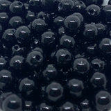 Close-up of black beads with a glossy finish