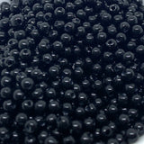 Close-up of black beads stacked together